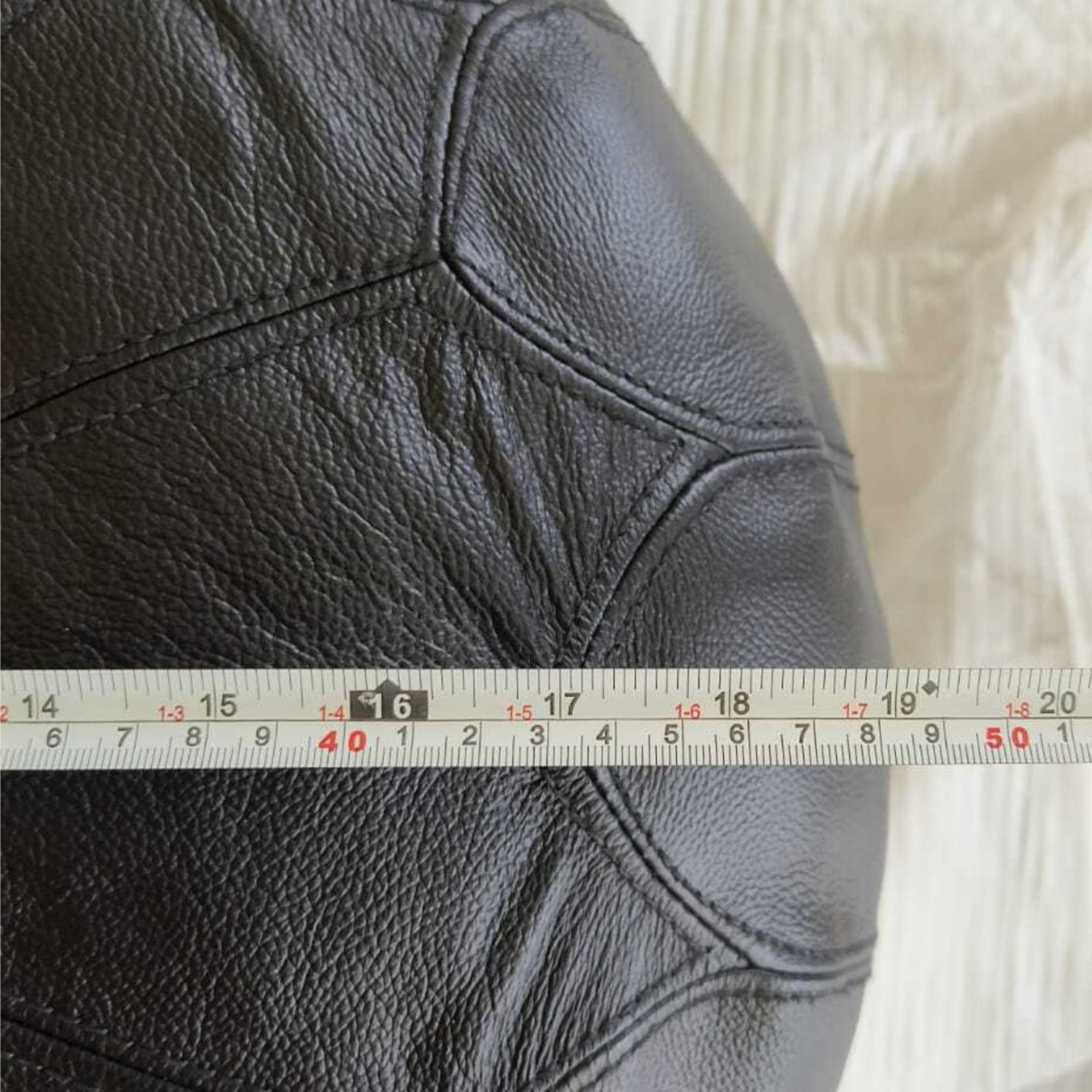 Dakota Black leather round ottoman