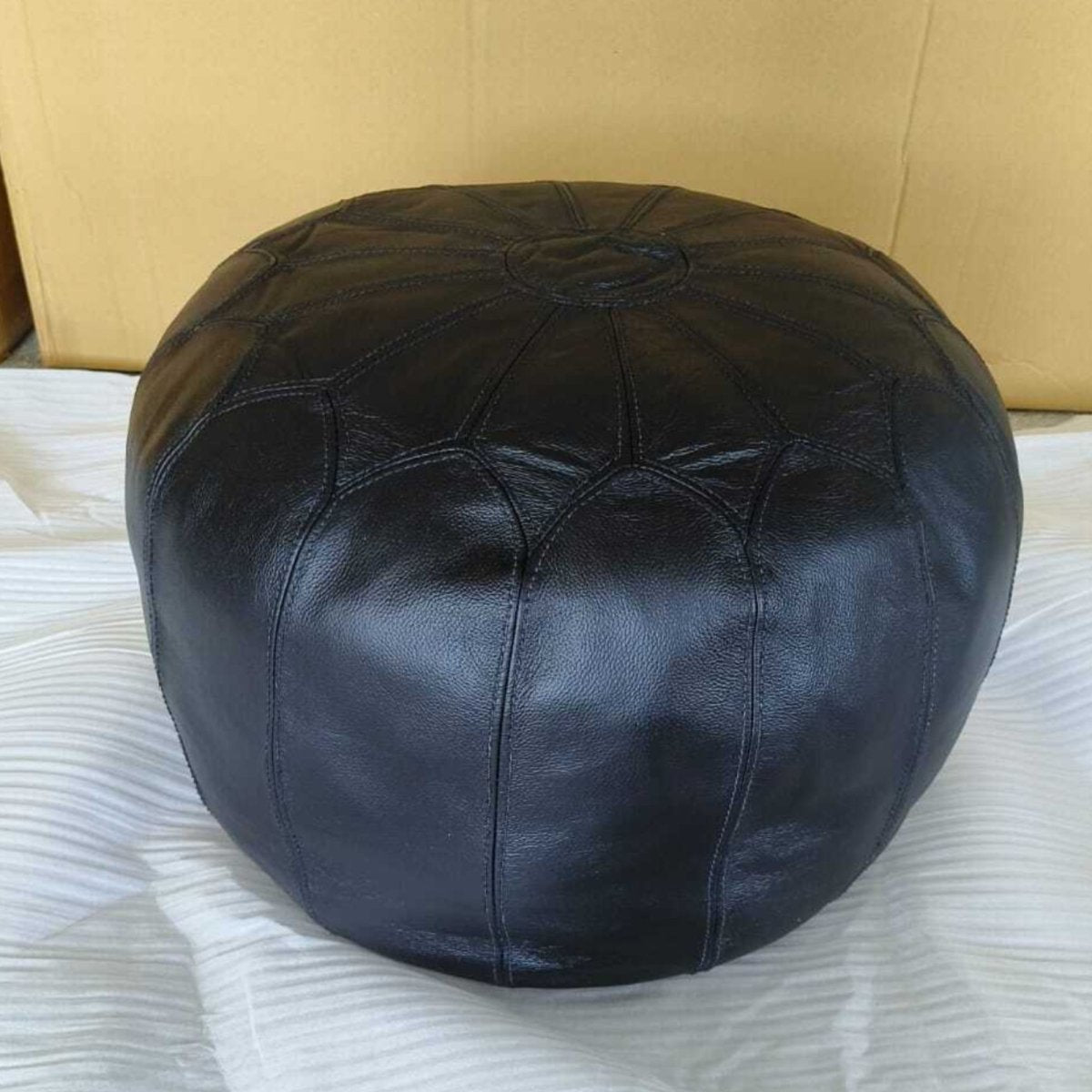 Dakota Black leather round ottoman - Rustic Furniture Outlet