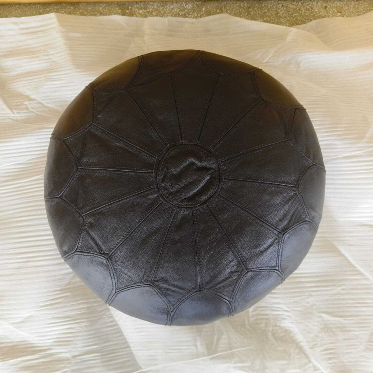 Dakota Black leather round ottoman - Rustic Furniture Outlet